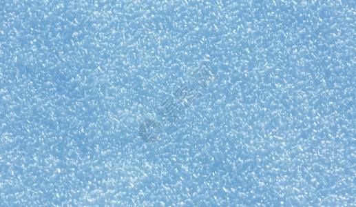 雪花结晶近身雪地背景图片