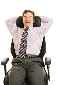快乐笑的商人享受着他新的文工程办公椅高清图片