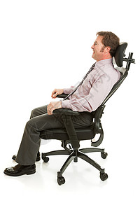 商人在舒适的体工程学办公椅上放松全身都是白色的高清图片