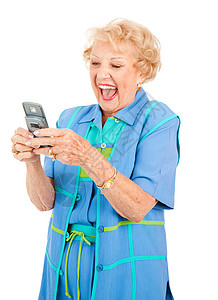 年长女子在看有趣的短信时笑着孤立在白色上会话高清图片素材
