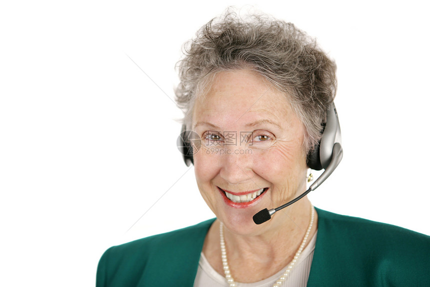 一个微笑的快乐戴着电话耳机的高级女士孤立在白色上图片