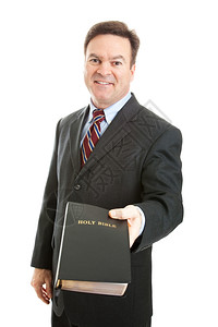 商人牧师或传教士持有一本圣经图片