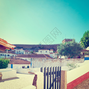 葡萄牙历史中心城市奥比多斯栅栏上的小门Instagram效果建筑学高清图片素材