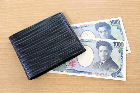 日本钞票在钱包里写木头背景上背景