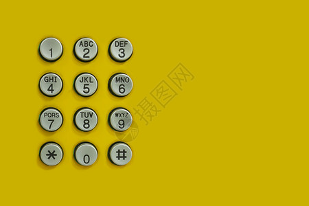 设计技术背景的黄色上电话数字键盘背景图片