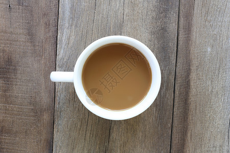 白咖啡杯放在旧木地板上设计咖啡因饮料背景图片