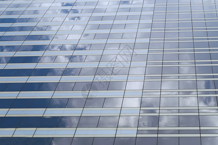 高楼的玻璃蓝色天空的光亮设计业务背景图片