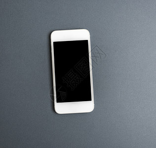 白智能手机灰色背景顶视图上有空白黑屏色智能手机背景图片