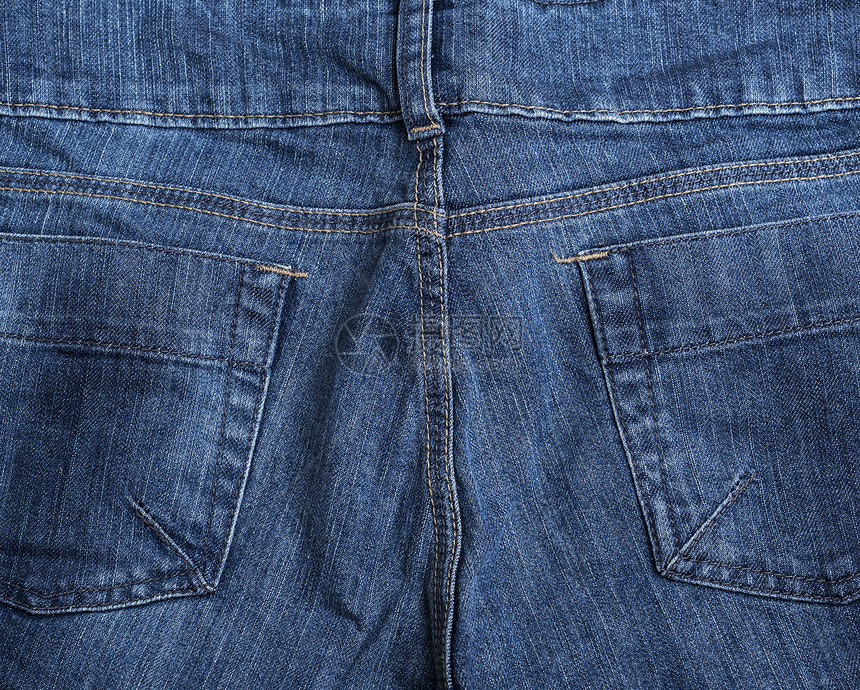 蓝色纺织品牛仔裤背面的碎片带口袋全框图片