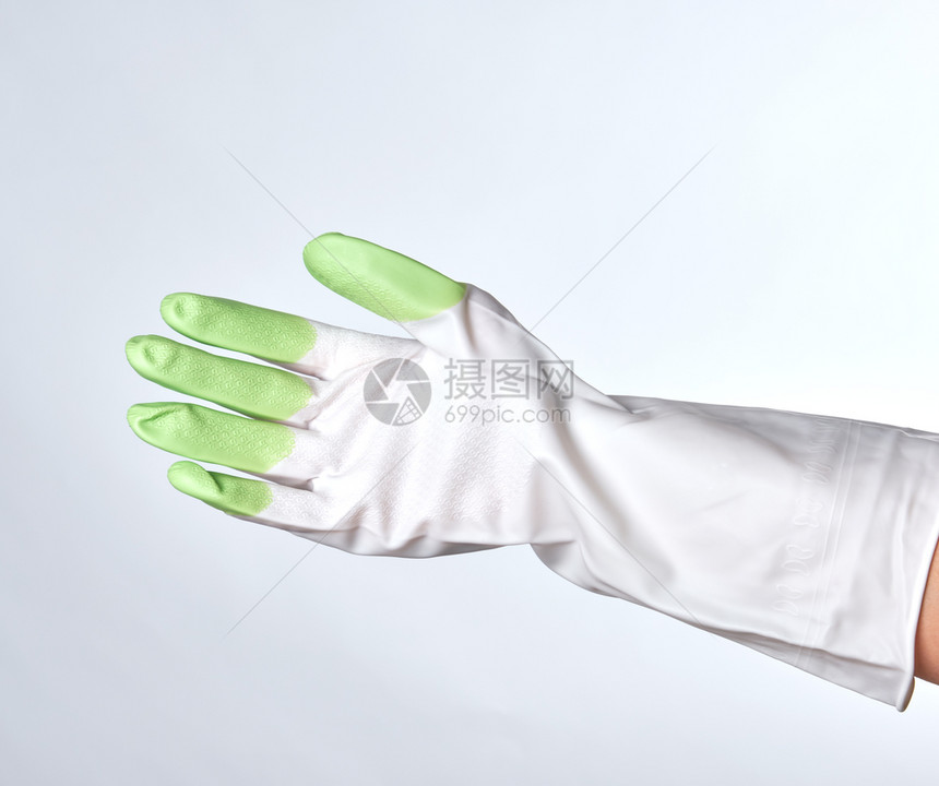 白色背景上的绿橡胶手套图片