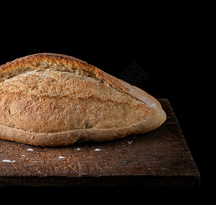 白面粉黑底木板上烤面包白色高清图片素材