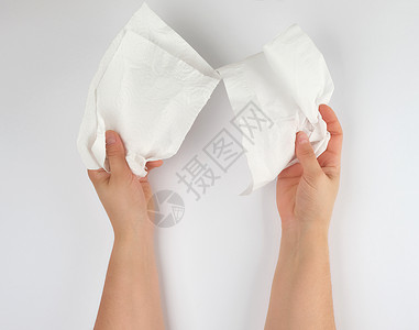 女手拿着干净的白纸巾脸和身体白色背景图片