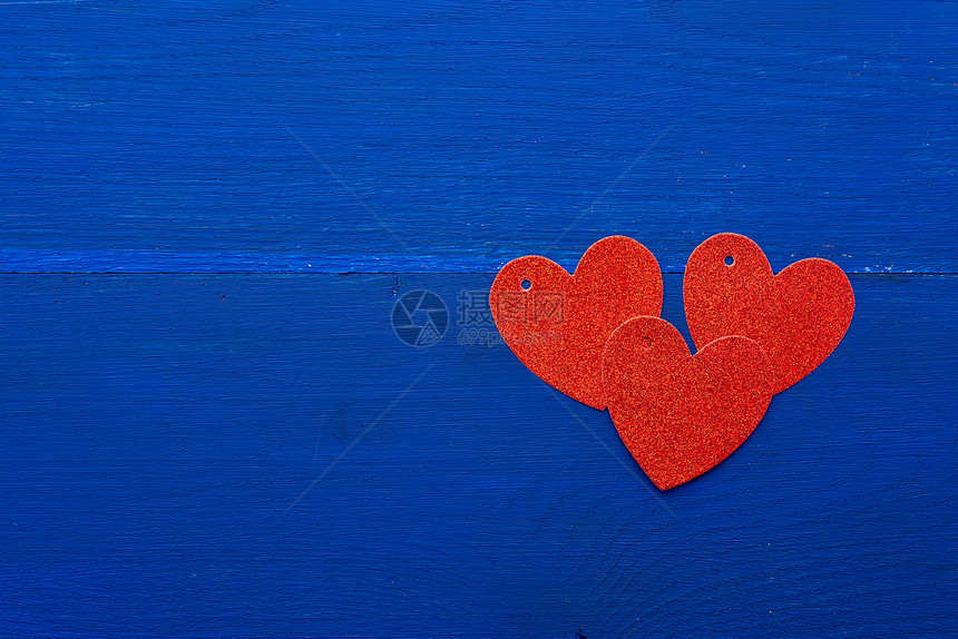 深蓝木背景上的红光亮装饰心情人节日的抽象背景图片