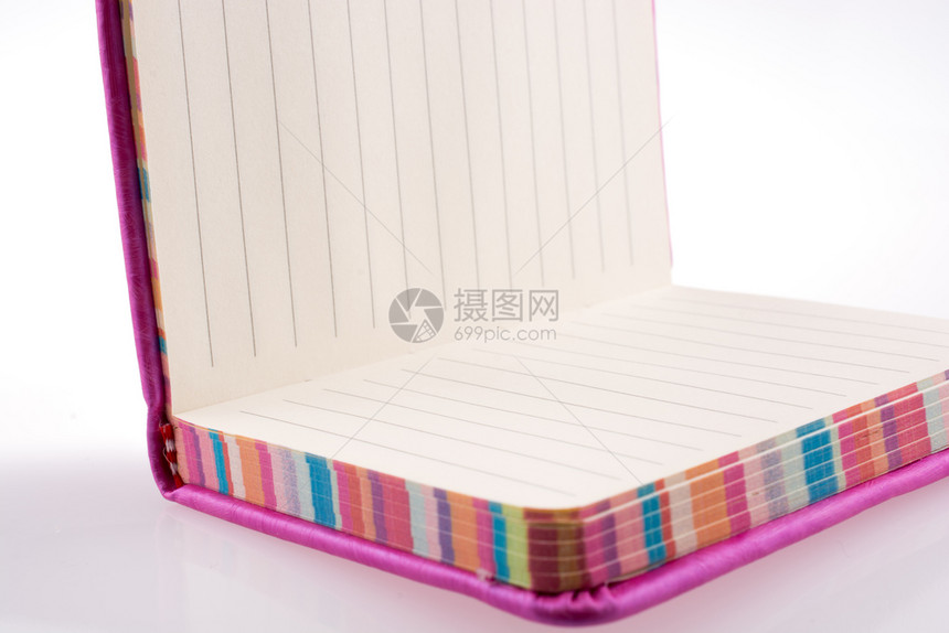 白背景上的粉红笔记本图片