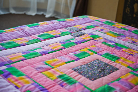 毯子从布料的亮片上被绑在床毯子手工从布料的3028片上缝合图片