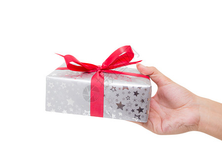 红礼盒白丝带将手放在色背景上用于圣诞节和新年或假日图片
