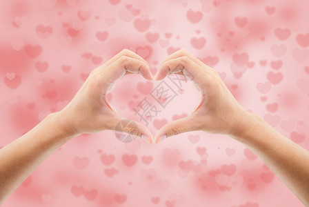 王者荣耀凯粉红色布凯模糊背景的手心形状符号情人节假日概念设计图片