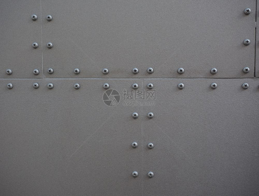 灰钢金属质料螺丝作为背景有用金属质料背景图片