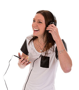 拥有耳机的快乐女人听她电话的音乐图片