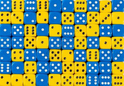 70个随机订购蓝色和黄骰子的图样背景70个随机订购蓝色和黄骰子的背景图片