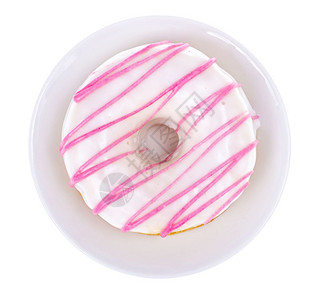 美味甜圈在光背景上加白粉色玻璃工作室照片图片