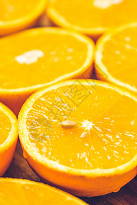 橙色背景关闭半切水果以彼此相邻的模式关闭半切水果图片