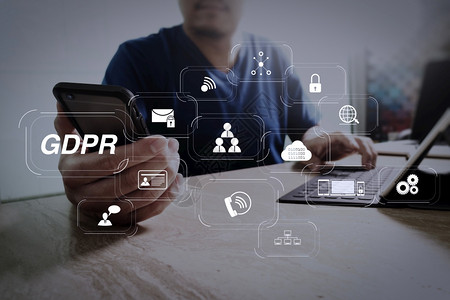 GDPR带有网络安全和隐私虚拟图的数据保护条例使用智能电话和键盘码头数字板设计师世界网络连接技术口书桌高清图片素材