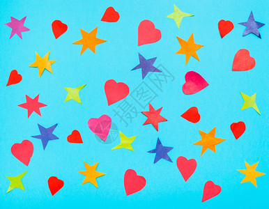许多星和红心从蓝绿的面纸上彩剪切出来背景图片