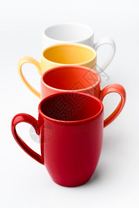明亮的生动丰富多彩红色橙黄和白的明亮彩杯子白底黑的亮彩色杯子图片