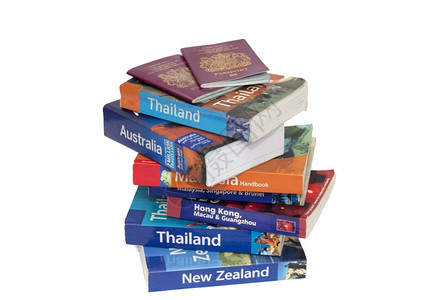 旅游各种行书籍和护照洪马来西亚背景图片