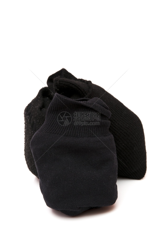 棉布白色背景的黑袜子色羊毛图片