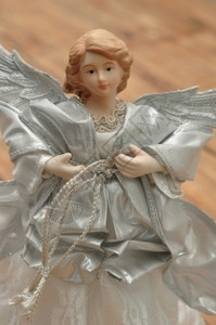 美丽的装饰品一个穿着银色的天使装饰圣诞树一种背景图片