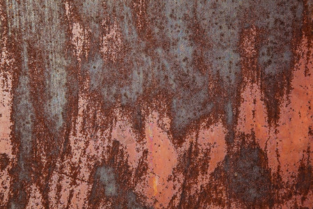 含淡褐色油漆背景的锈铁染色金属橙背景图片