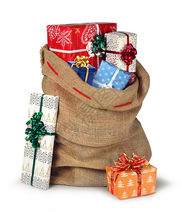 圣诞礼物薄饼麻袋满美丽的礼物盒子被白色的纸盒隔绝展示秘密包图片