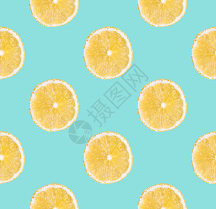 新鲜的食物黄柠檬新片无缝模式关闭柑橘水果切片在面食蓝背景上摄影室背景新鲜黄色柠檬切片没有缝合模式关闭工作室摄影成熟背景图片