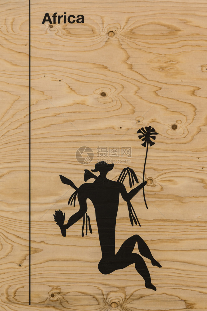 象征木制的狗图形SilhouetteIInducationonWooden背景人皮和鲜花图片
