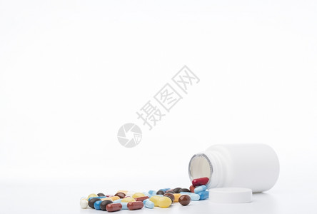倾倒麻醉剂白色药丸瓶在白色背景上药丸瓶在白色背景上橙图片