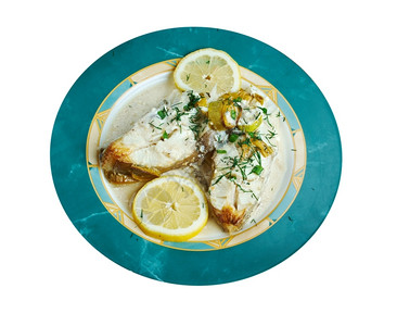 新鲜的LemonCream的卤丁配有柠檬和新鲜蔬菜地面鱼图片