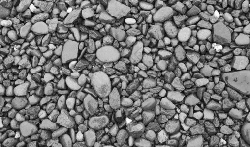 灰色的湿卵石岩背景头纹理布料背景海白色的图片