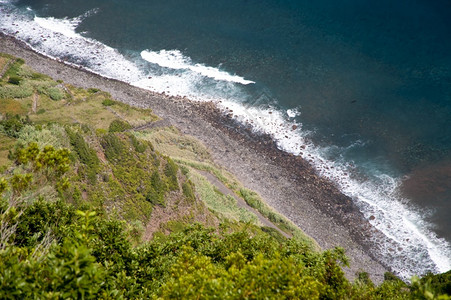 海岸蓝色的旅游在马德拉波尔图加岛背景图片