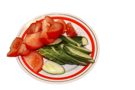 生的美味有机盘子上切西红柿和黄瓜图片
