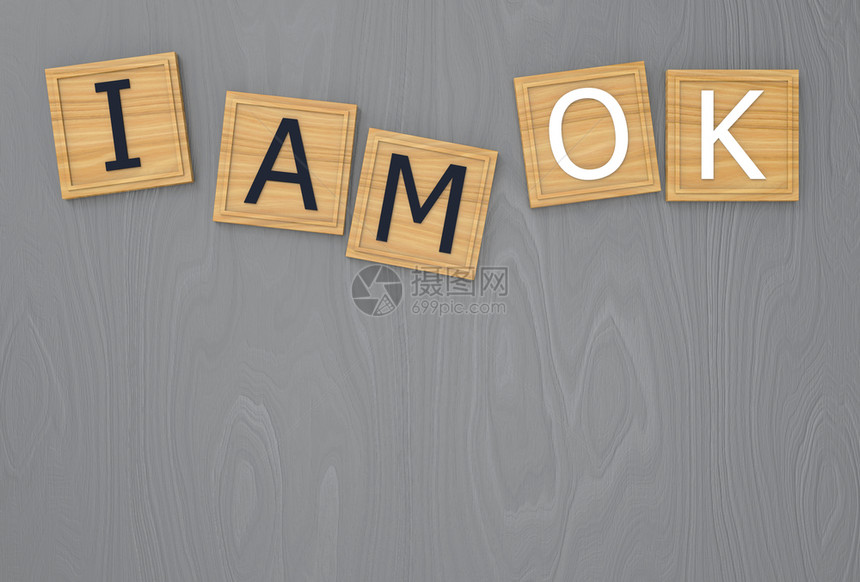 积极的象征3dmakeIamok字词写在棕色方木的填字框上复制空间灰色表格作为背景信息图片