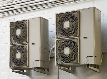 经济工业墙上空调机的温室工业的背景图片