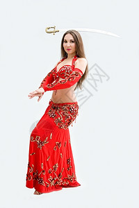 美丽的腹部舞女穿着红色衣服平衡隔离戏服中间女士图片