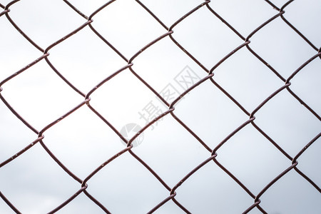 建造关联监狱村里栅栏铁笼的背景图片
