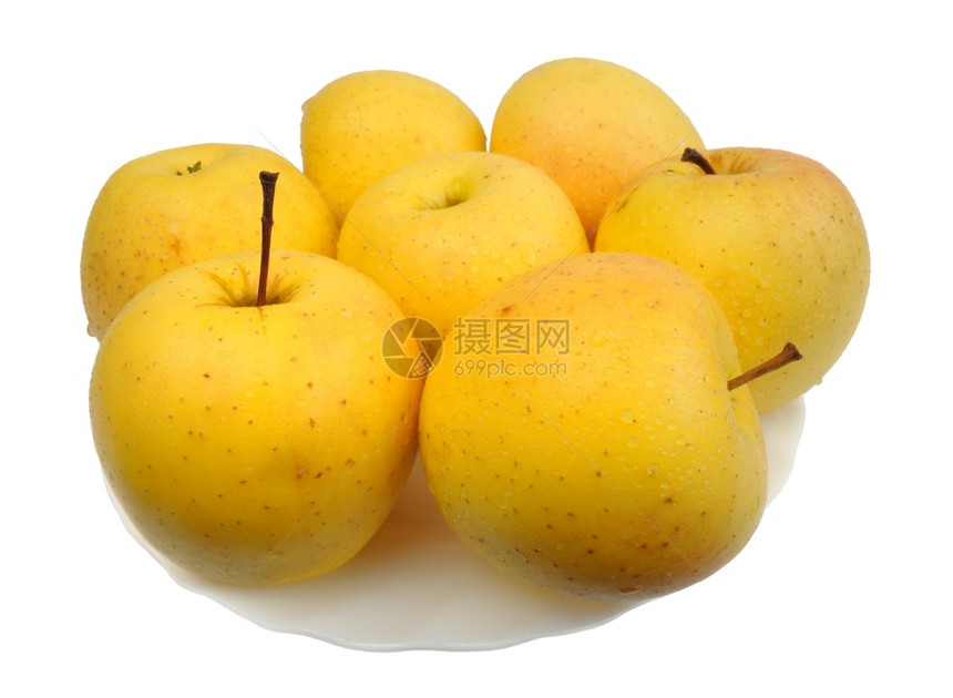 一种白色盘子上的黄苹果白底孤立黄色的水果图片