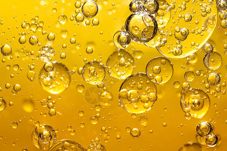 湿的泡沫金黄油抽象背景金子图片