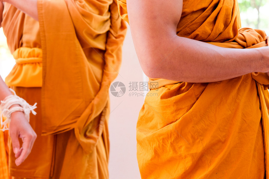宗教的佛和尚黄袍佛教和尚的紧贴颜色质地图片