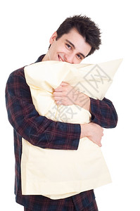 检查穿着睡衣带白背景被孤立的枕头微笑着青年男子家白种人背景图片