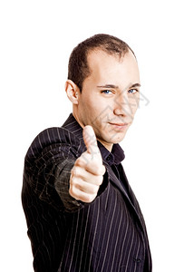 一个年轻商人的肖像举起拇指孤立在白色背景上庆祝成功的青年快乐的高清图片素材